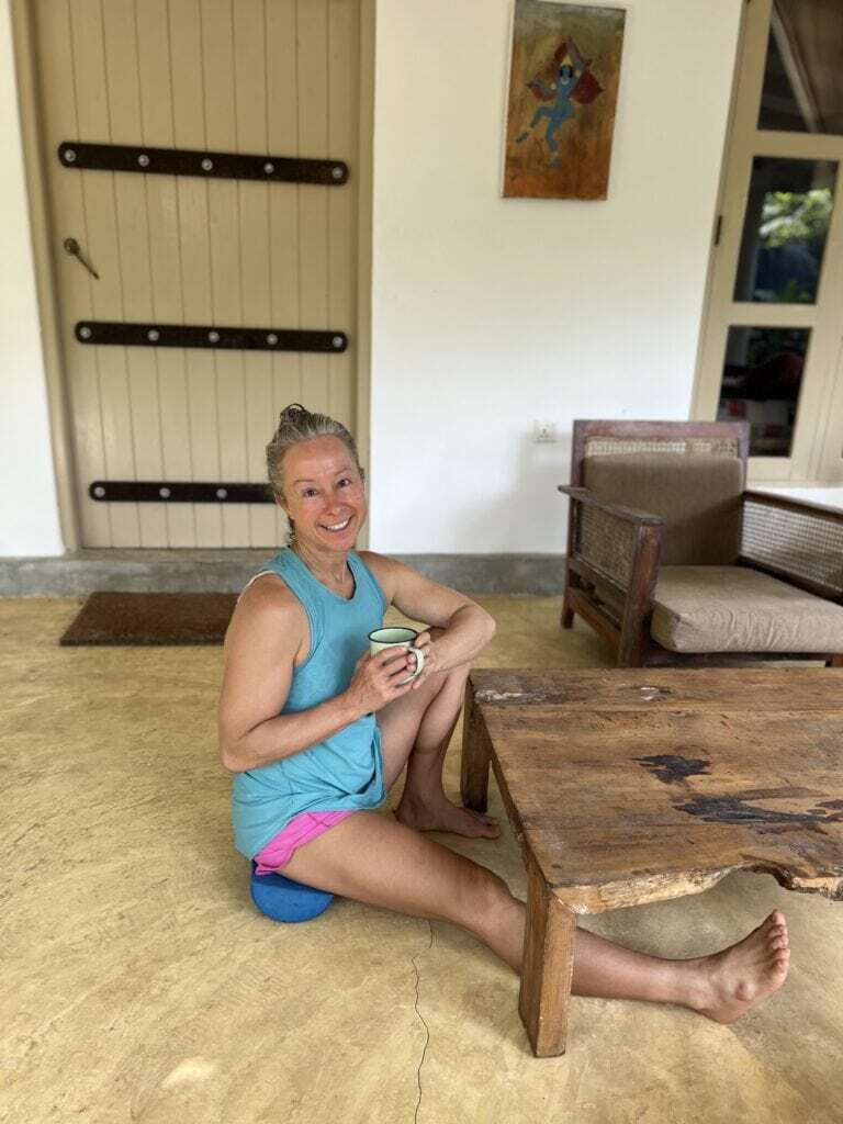 Woman sitting on the floor.