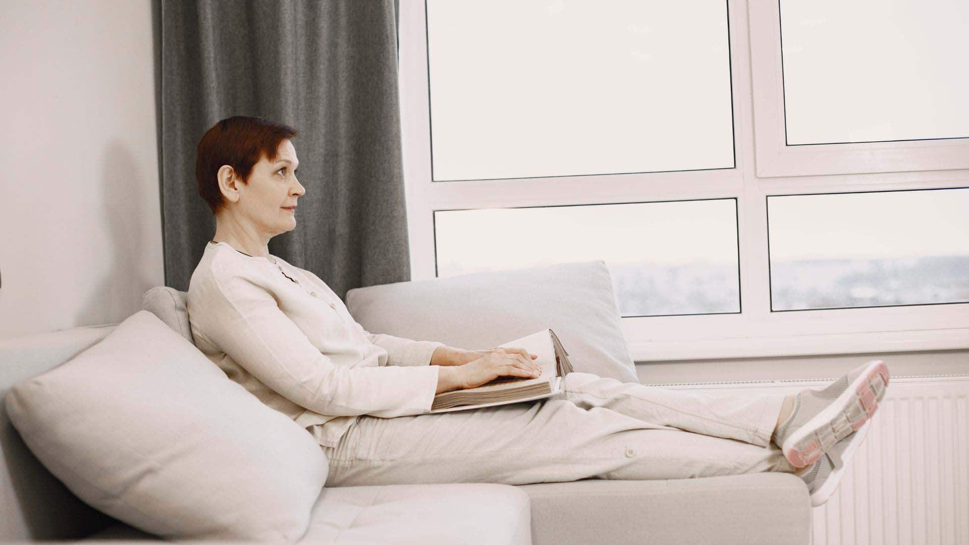 Woman laying on the couch.