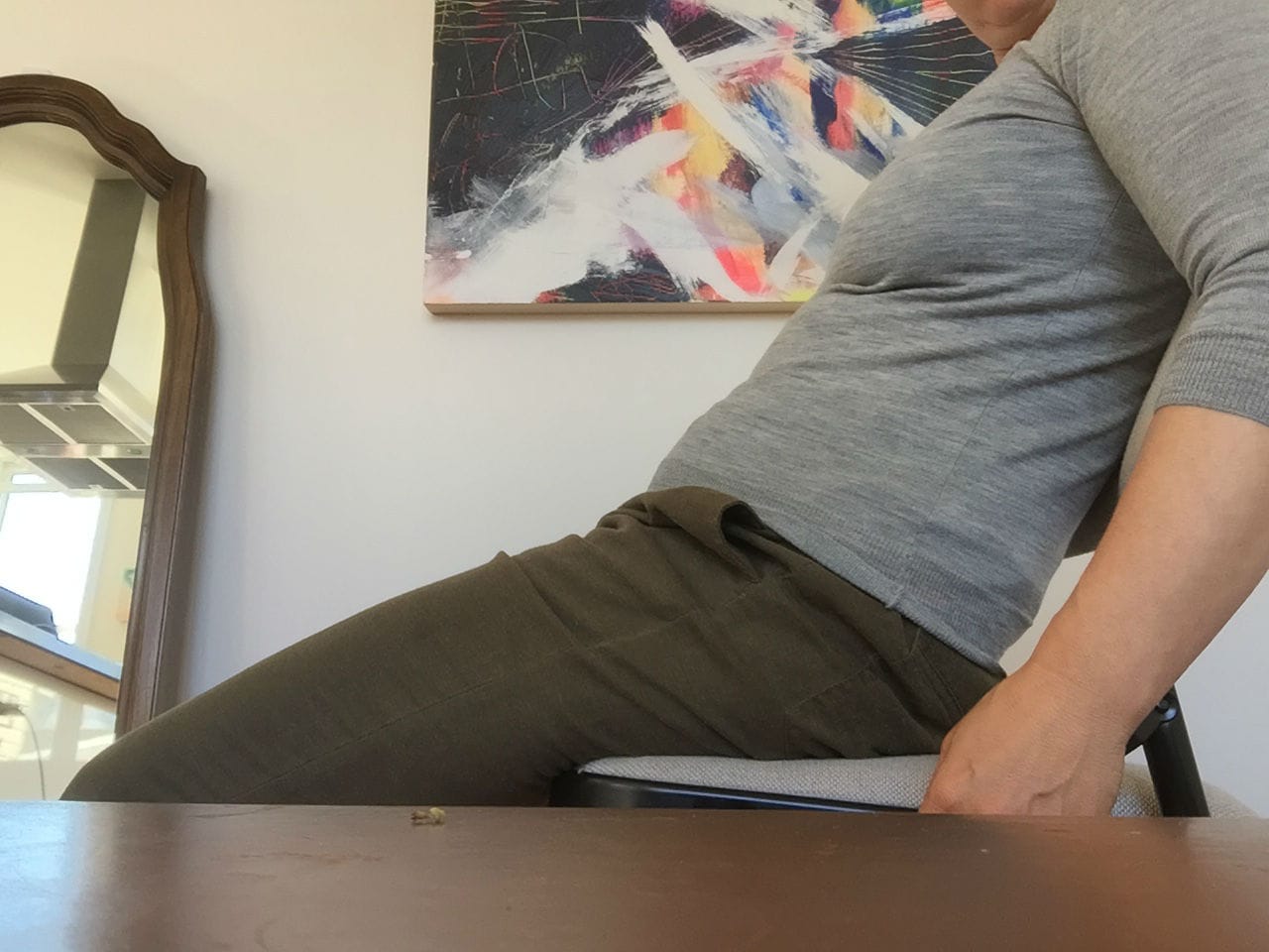 Sitting with tucked pelvis