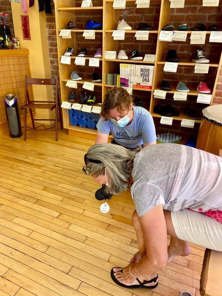 Woman is choosing minimal shoes.